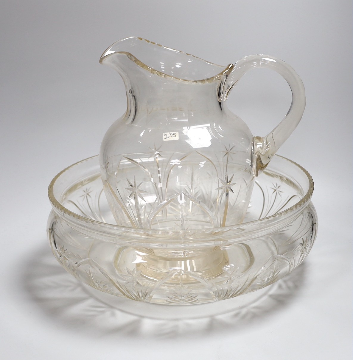 A Victorian/Edwardian cut glass toilet jug and basin
